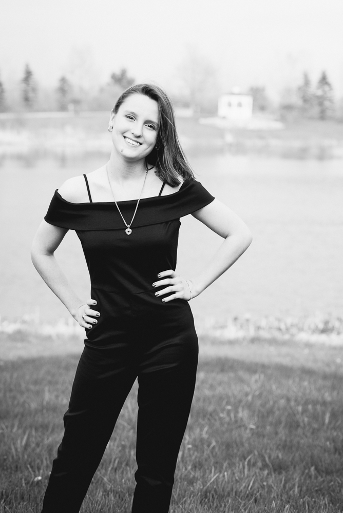 HIGH SCHOOL SENIOR GIRL IN FIELD