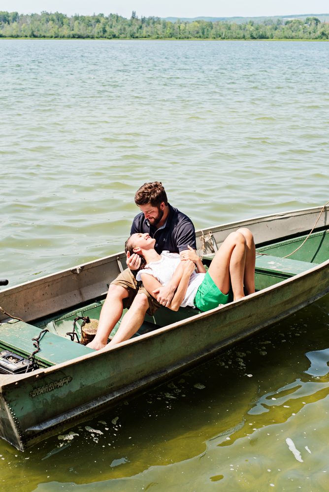 engagement couple on row boat