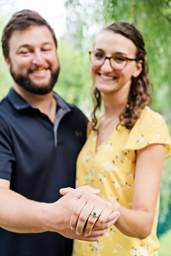 Engagement couple holding hands