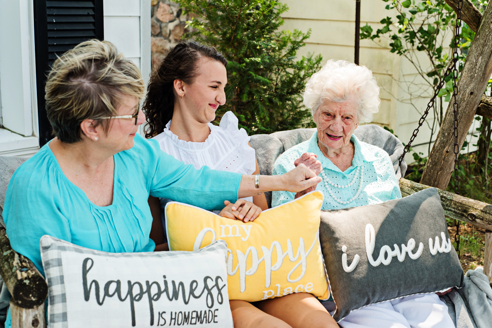 Grandma, Mom and daughter-in-law fist bumping