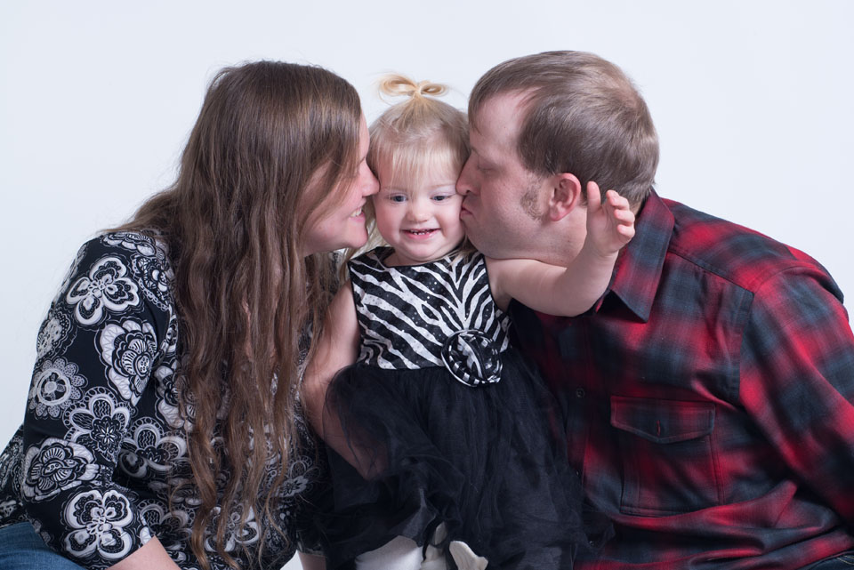 family plays games and gives hugs as they have a stress free family session
