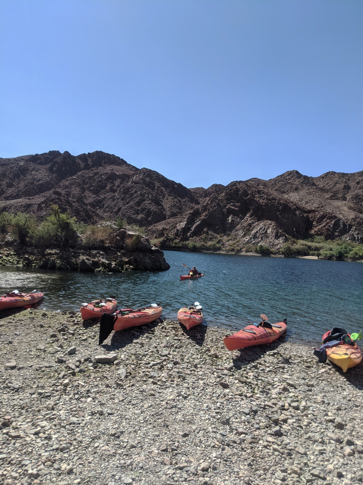 Group of Kayaks on Colorado shore