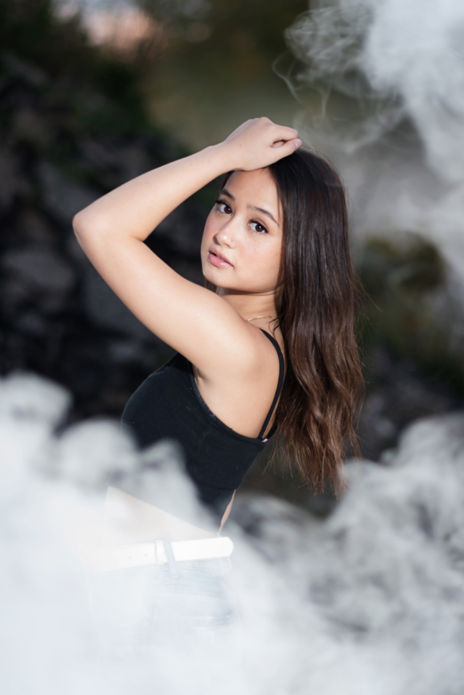 high school senior girl surrounded by smoke