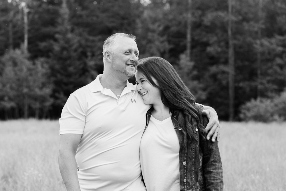 black and white photo of a couple engaged