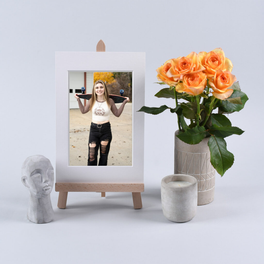 Graduation pictures displayed in frames at a graduation party