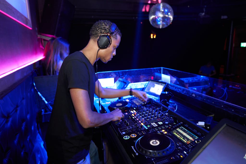 Man Wearing Black Crew-neck Shirt Playing Dj Turntable at a graduation party
