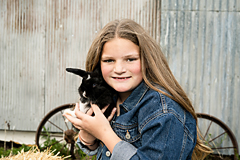 little girl with pet rabbit