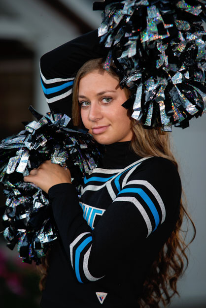 High school senior cheerleader with ponpoms
