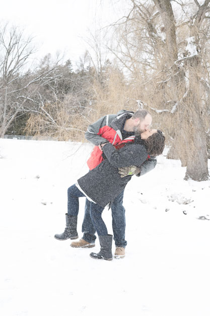 man dipping woman on a snowy day