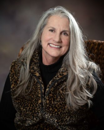 headshot of long haired alder lady