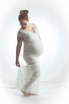 pregnant woman looking down at her ankle