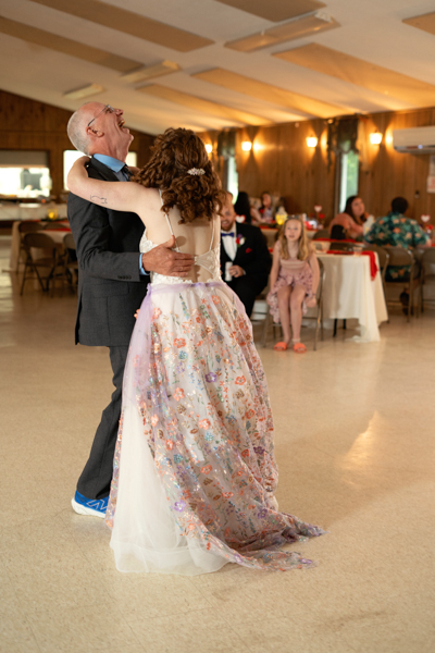 Father-daughter dance at a wedding reception.