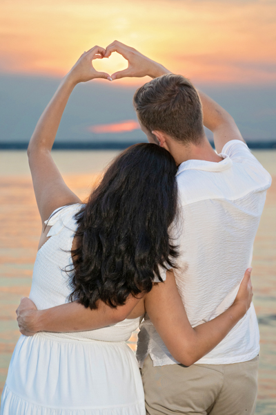 Proposal couple with hands making a heart
