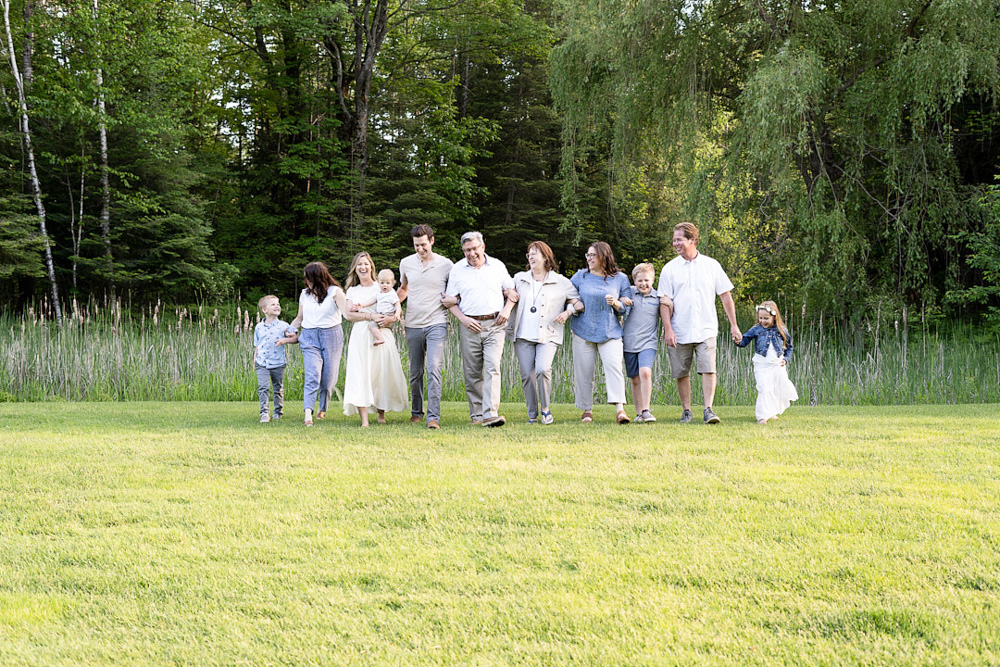 Large Extended family all walking across the grass at Sugar Springs Golf Course in Gladwin
