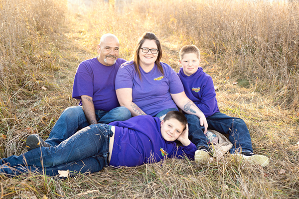 family of four at sunset in West Branch, MI