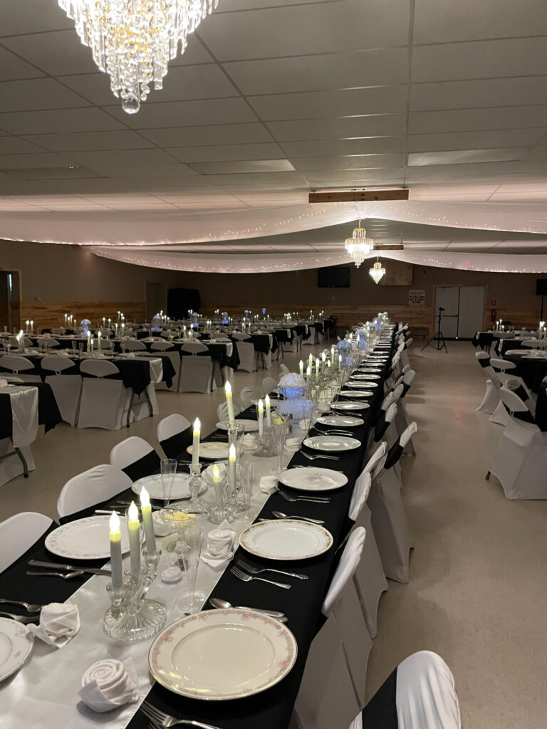 Knights of Columbus Wedding Venue Reception area with tables lined up and set with candles.