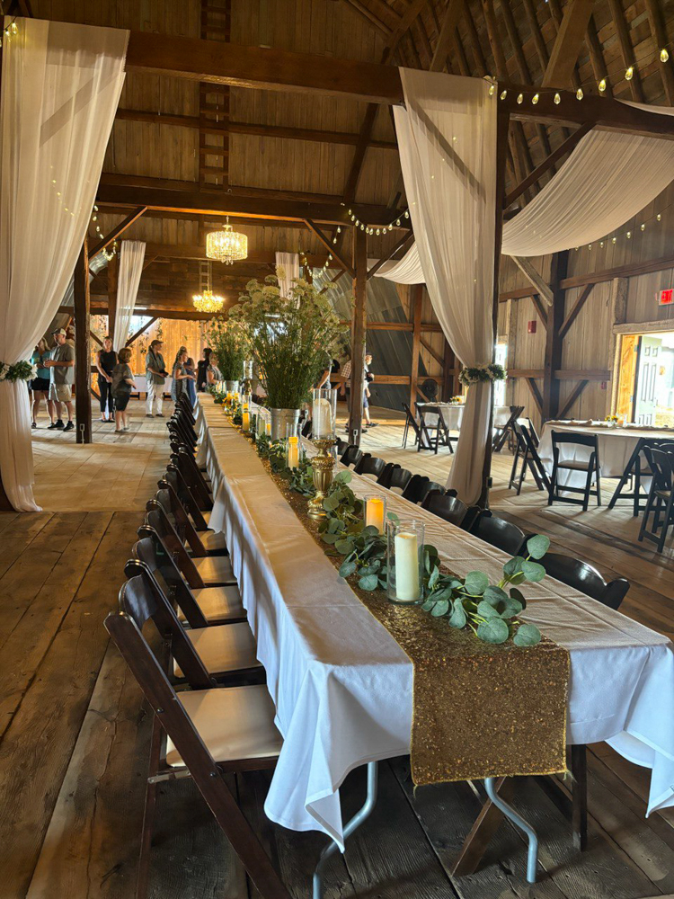 Table setting in a barn wedding venue