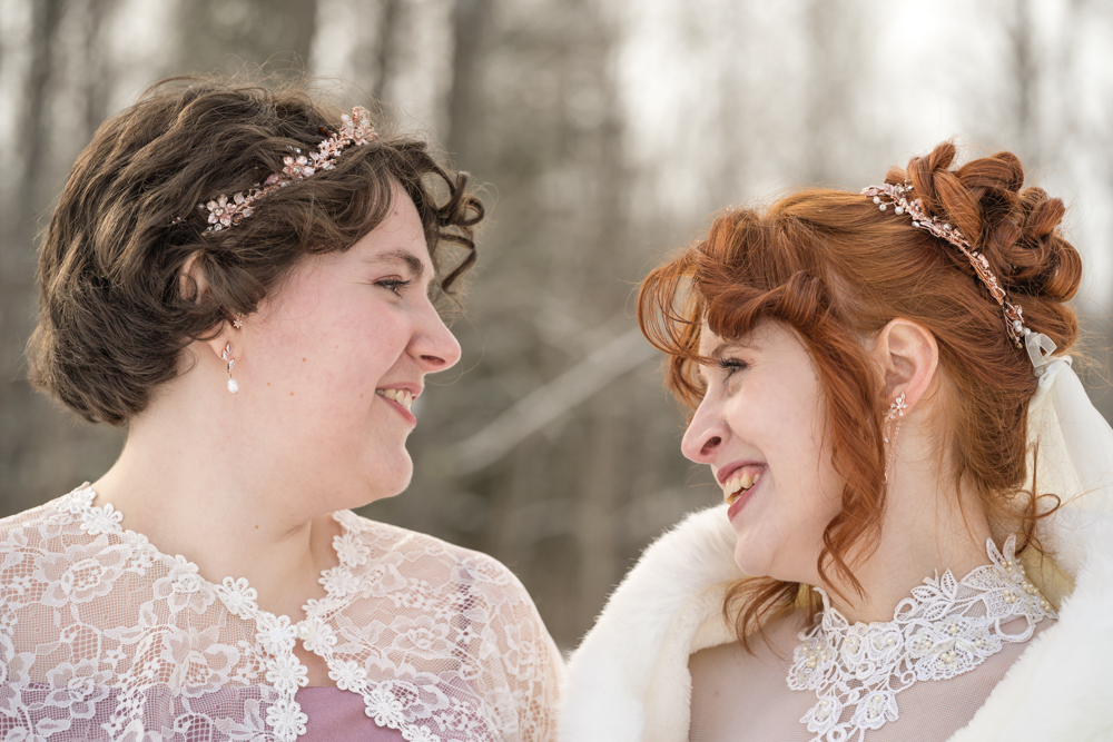 Bride and Maid of Honor Smiling at each other