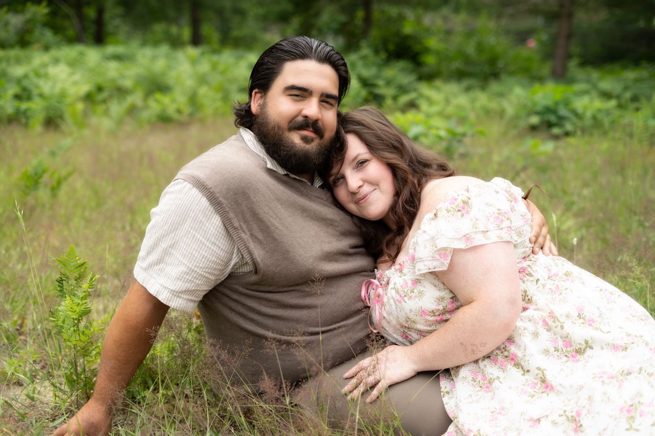 Couple sitting in tall grass