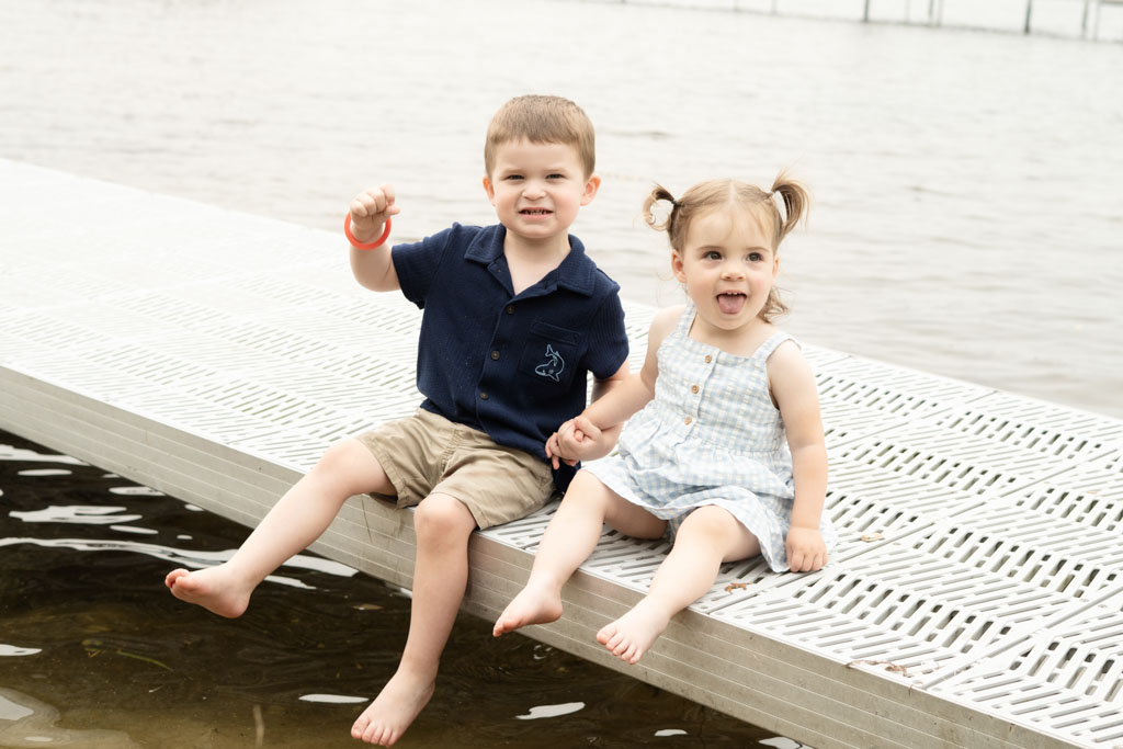 Young boy and girl sitting on the dock at Intermediate Lake.